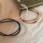 Gifty minimalist irregular acrylic headband in translucent beige on white background