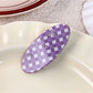 Purple plaid hair claw clip clipped into brown hair