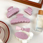 Beau sweet pink hair claw clip with white polka dots on a white background