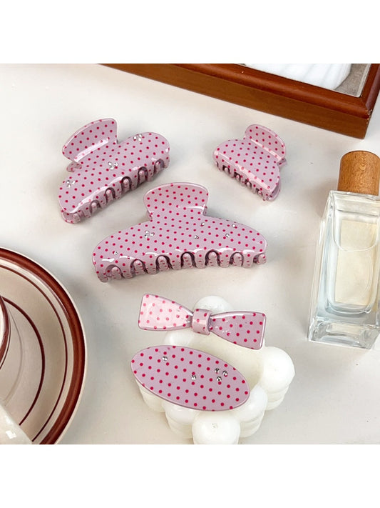 Beau sweet pink hair claw clip with white polka dots on a white background