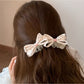 Side view of Beau printed bow banana clip highlighting bow shape and clip mechanism
