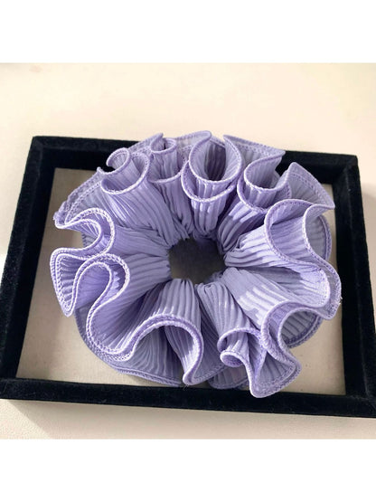 Gifty minimalist solid color ruffle scrunchie folded neatly on a flat surface