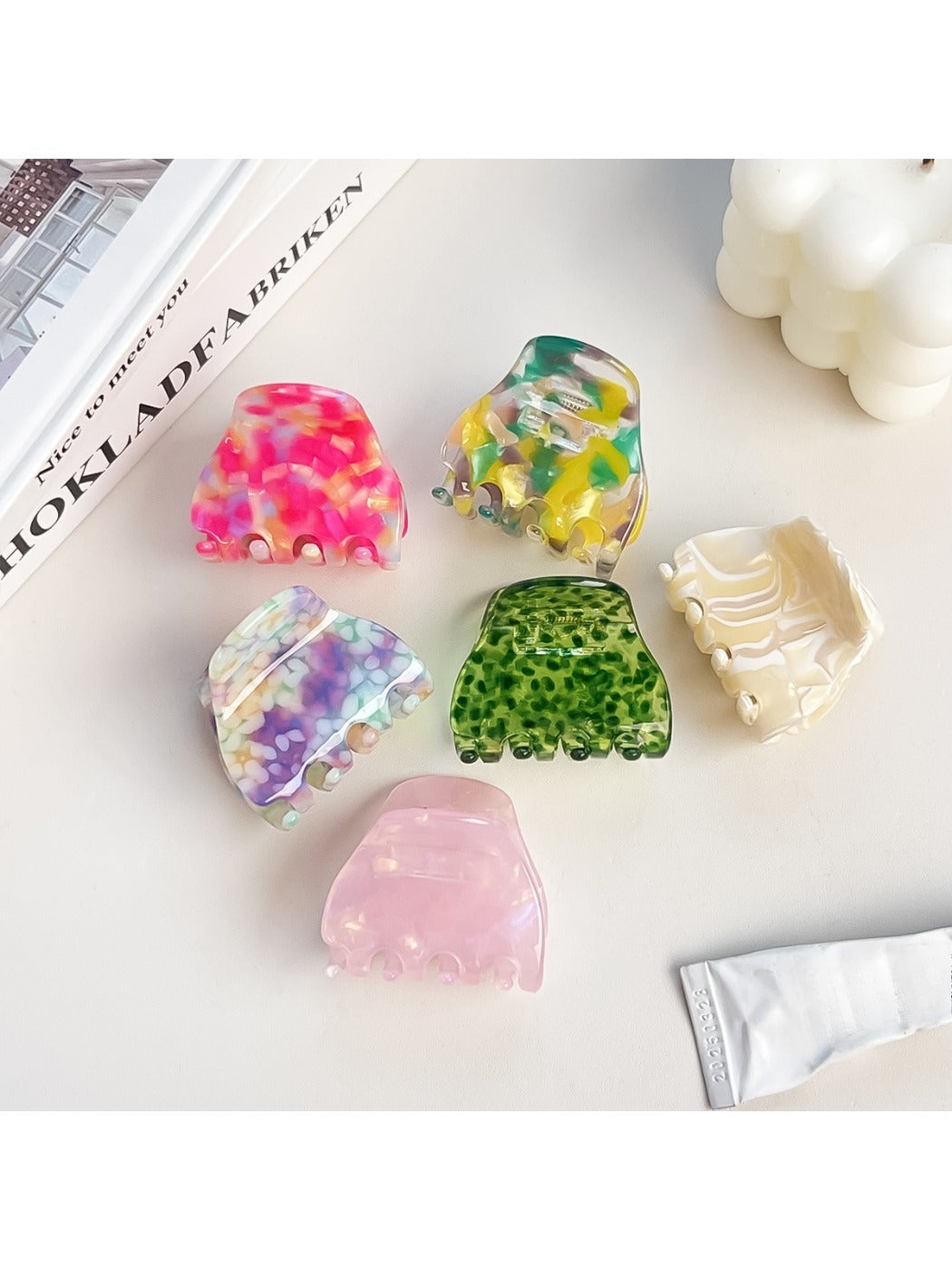 Close-up of Beau half moon claw clip showing multicolored design