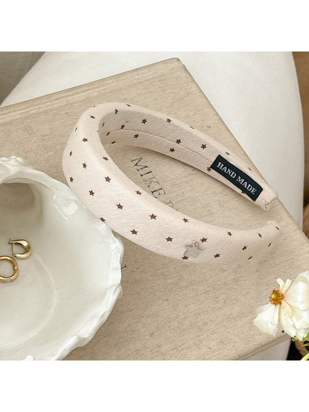 Top view of the star hairband highlighting the star shape and smooth band finish