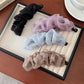 Side view of Beau tulle ruffle high ponytail claw clip highlighting clip mechanism