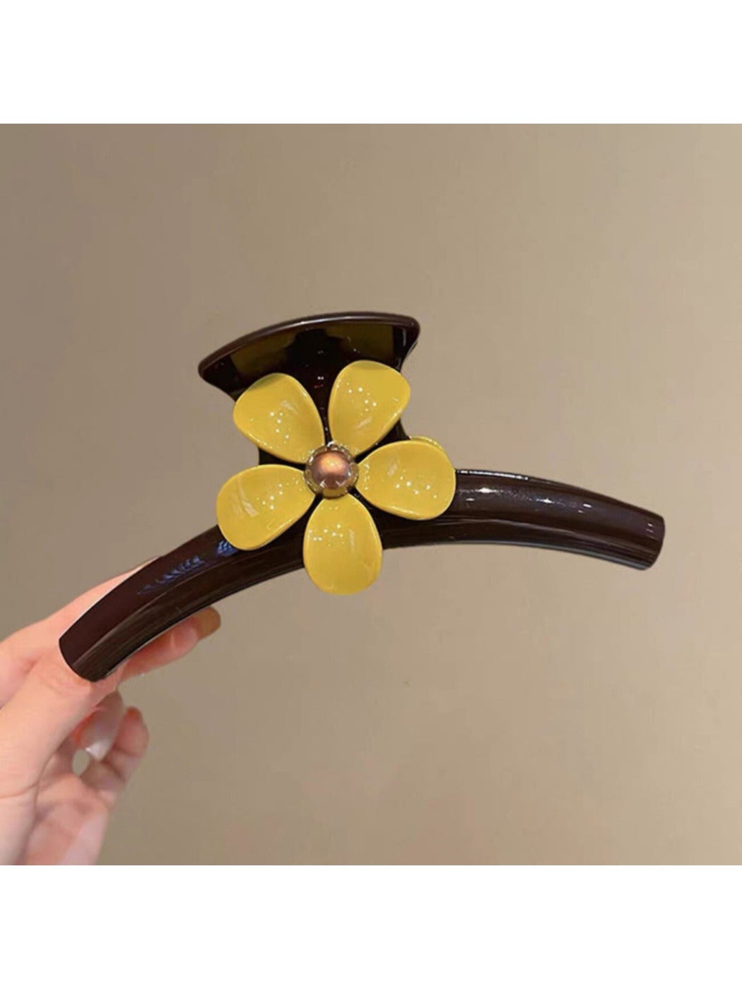 Beau minimalist flower-shaped claw clip in beige with soft shadows