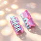 Close-up of Beau acrylic eyeglasses-shaped claw clip showing hinge detail