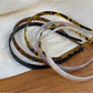 Close-up of vintage leopard print fabric texture on hairband