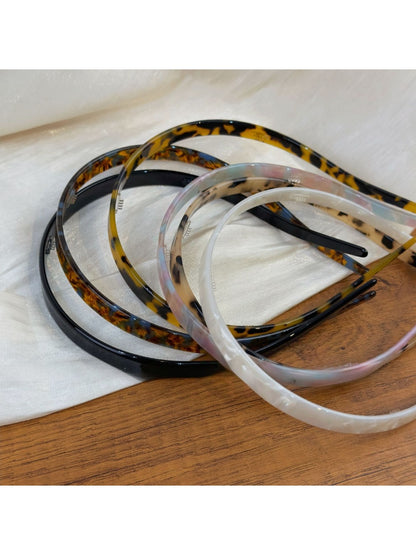 Close-up of vintage leopard print fabric texture on hairband