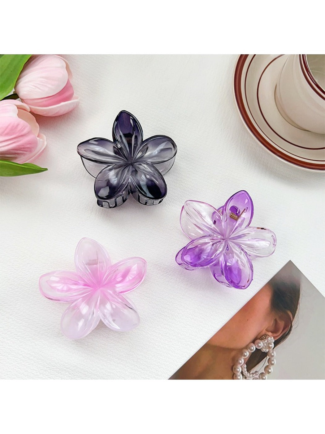 Close-up of Beau flower claw clip showing detailed petal design in multiple colors