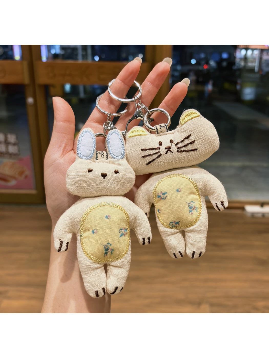 Keypus keychain featuring both kitty and bunny charms hanging from a silver ring