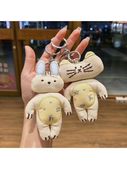 Keypus keychain featuring both kitty and bunny charms hanging from a silver ring