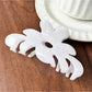 Beau sweet chic flower claw clip in soft pink with metal spring visible