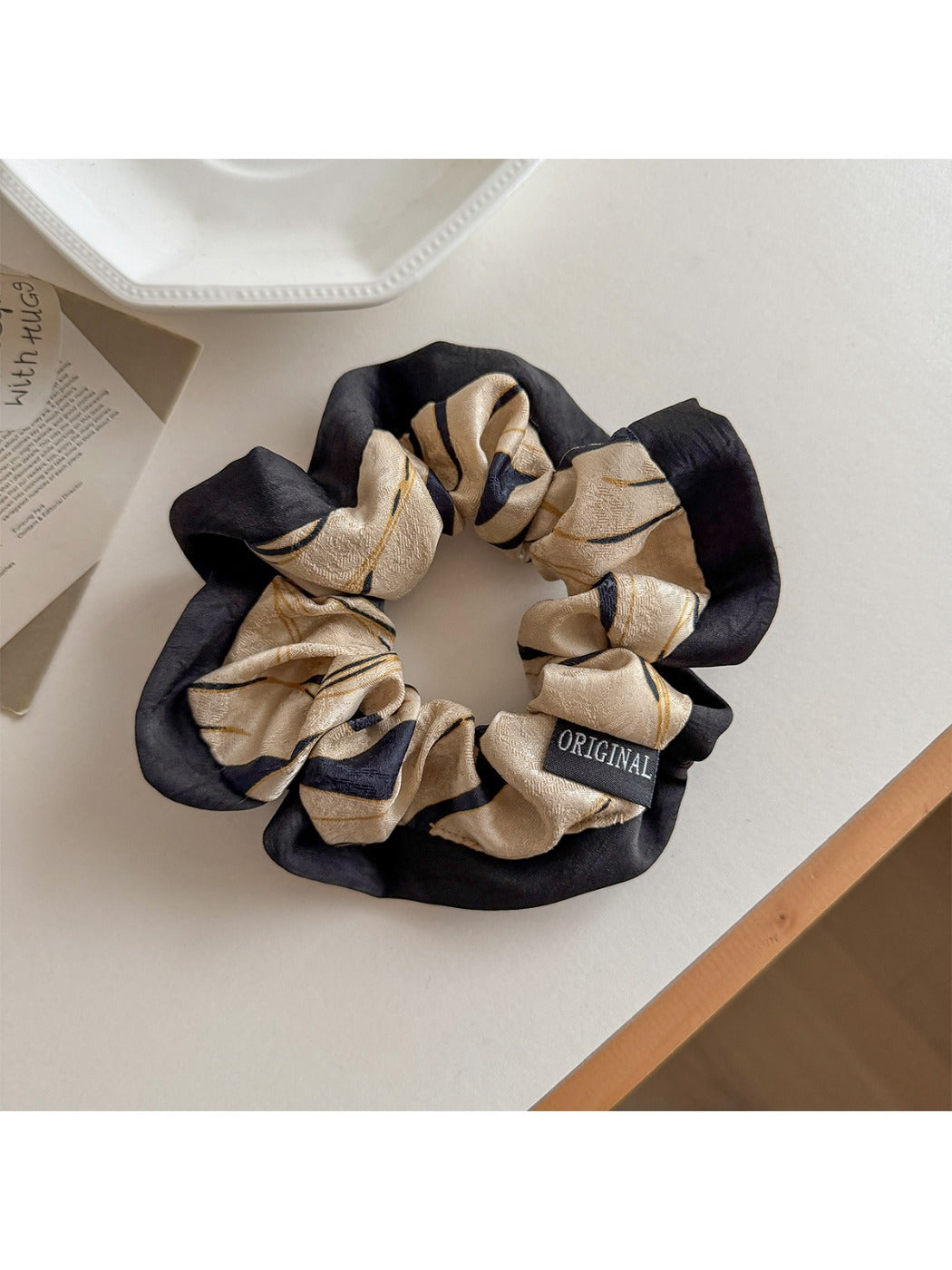Gifty scrunchie styled on a wrist as a colorful accessory