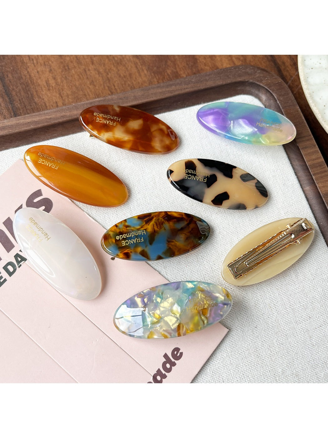 Close-up of Beau Sweet Oval Acetate Hair Clip showing glossy finish and oval shape