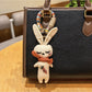 Vintage rabbit charm keychain displayed on a white background