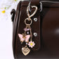 Butterfly heart shaped keychain with pink and purple gradient on white background