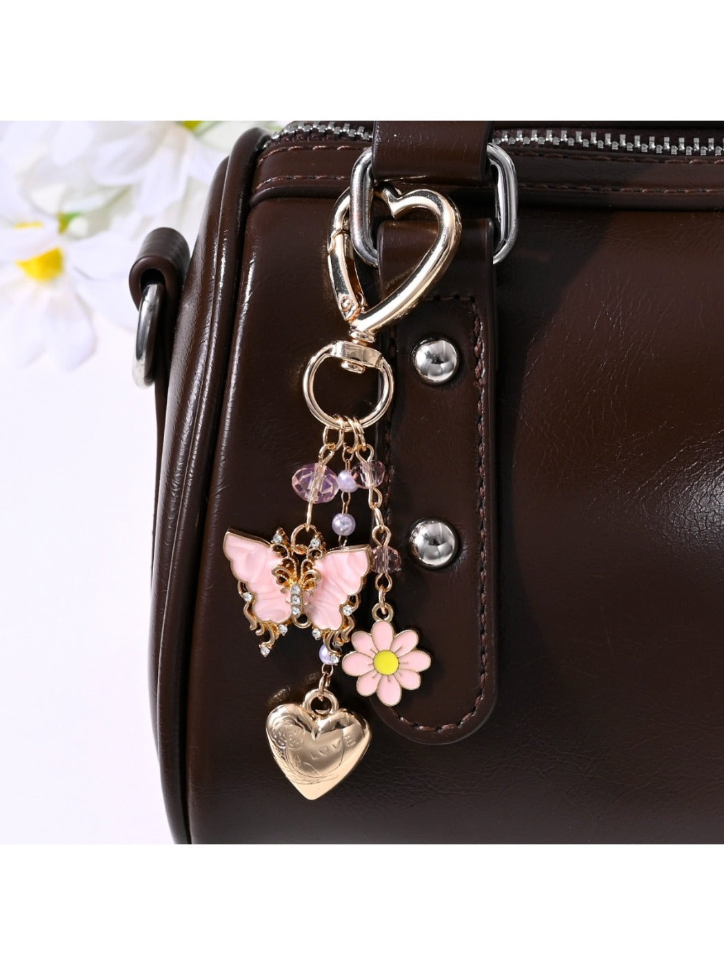 Butterfly heart shaped keychain with pink and purple gradient on white background