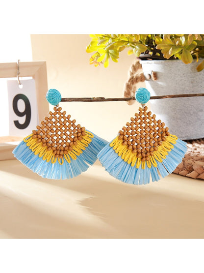 Vintage square raffia drop earrings displayed in a jewelry box with soft fabric lining