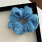 Gifty Lazy Style scrunchie styled in a ponytail, showcasing its decorative openwork