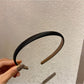 Close-up of satin headband edges and stitching details
