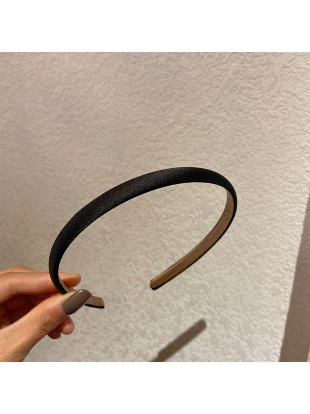 Close-up of satin headband edges and stitching details