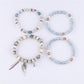 Side view of Lovra vintage layered beaded bracelet showing multiple strands