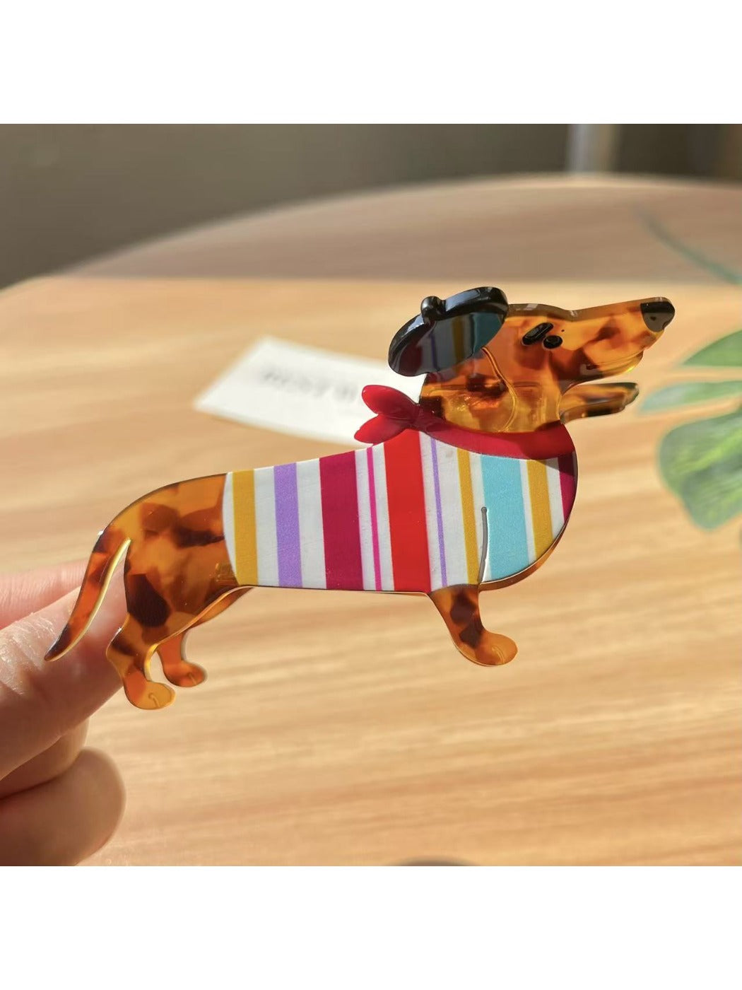 Beau dachshund claw clip displayed alongside other hair accessories