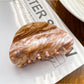 Beau elegant cloud pattern hair claw clip shown from angled perspective