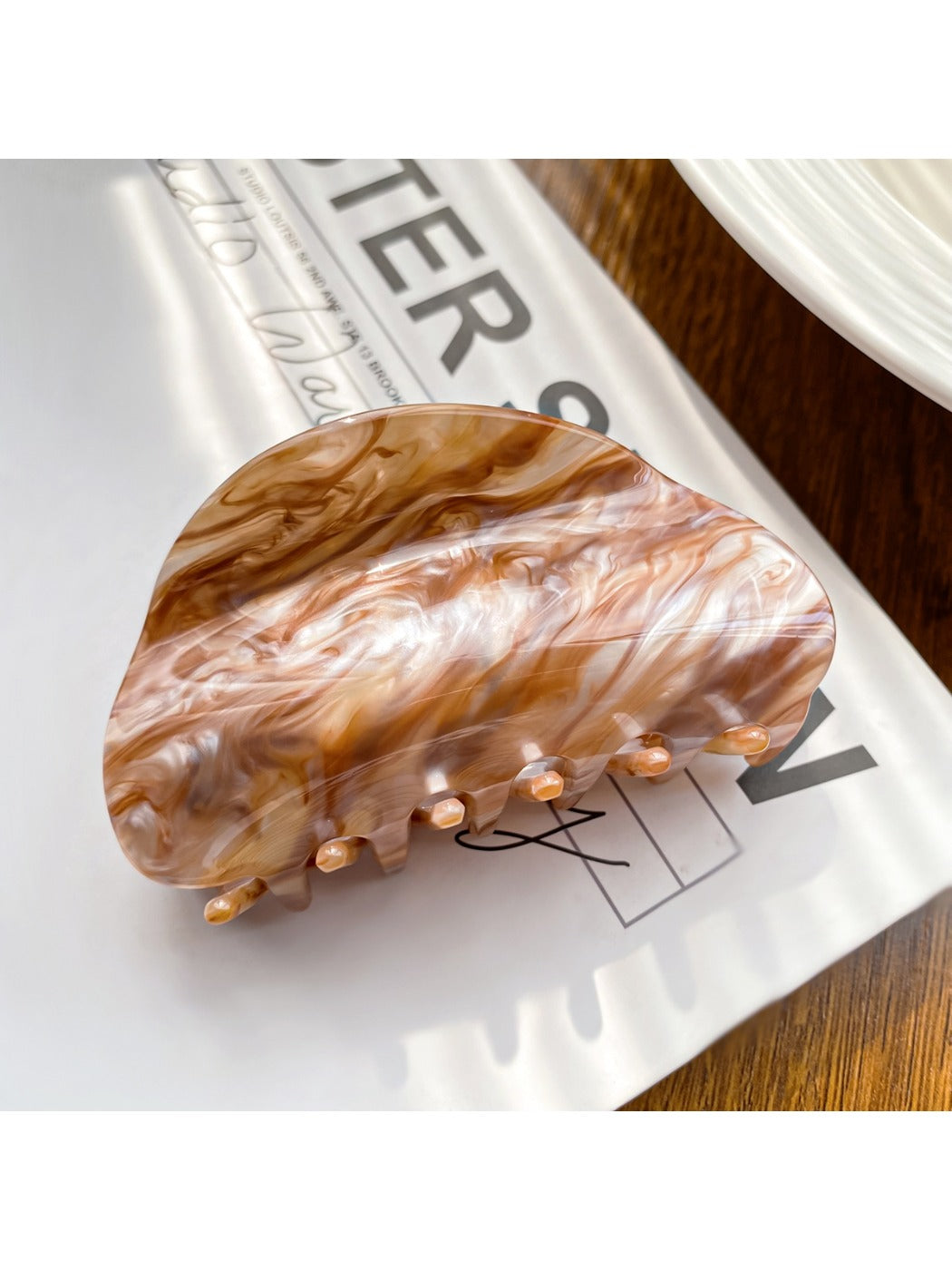 Beau elegant cloud pattern hair claw clip shown from angled perspective