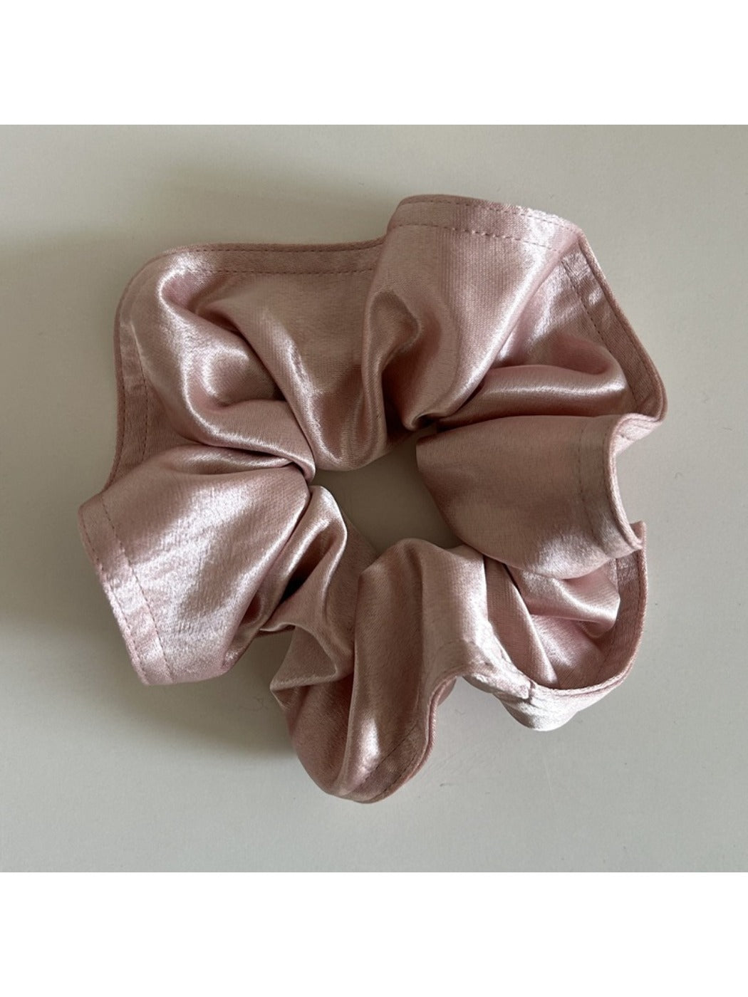 Side angle of Gifty satin scrunchie emphasizing thickness and lustrous finish