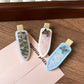 Beau acetate oval butterfly hair clip with translucent amber and brown pattern