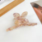 Beau minimalist hair claw clip in light beige color with bow detail