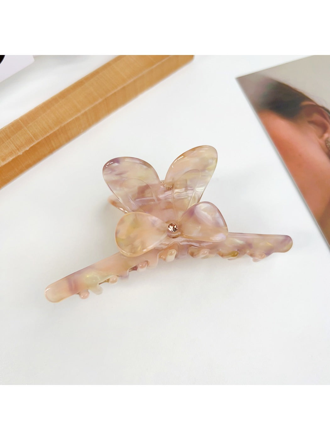 Beau minimalist hair claw clip in light beige color with bow detail