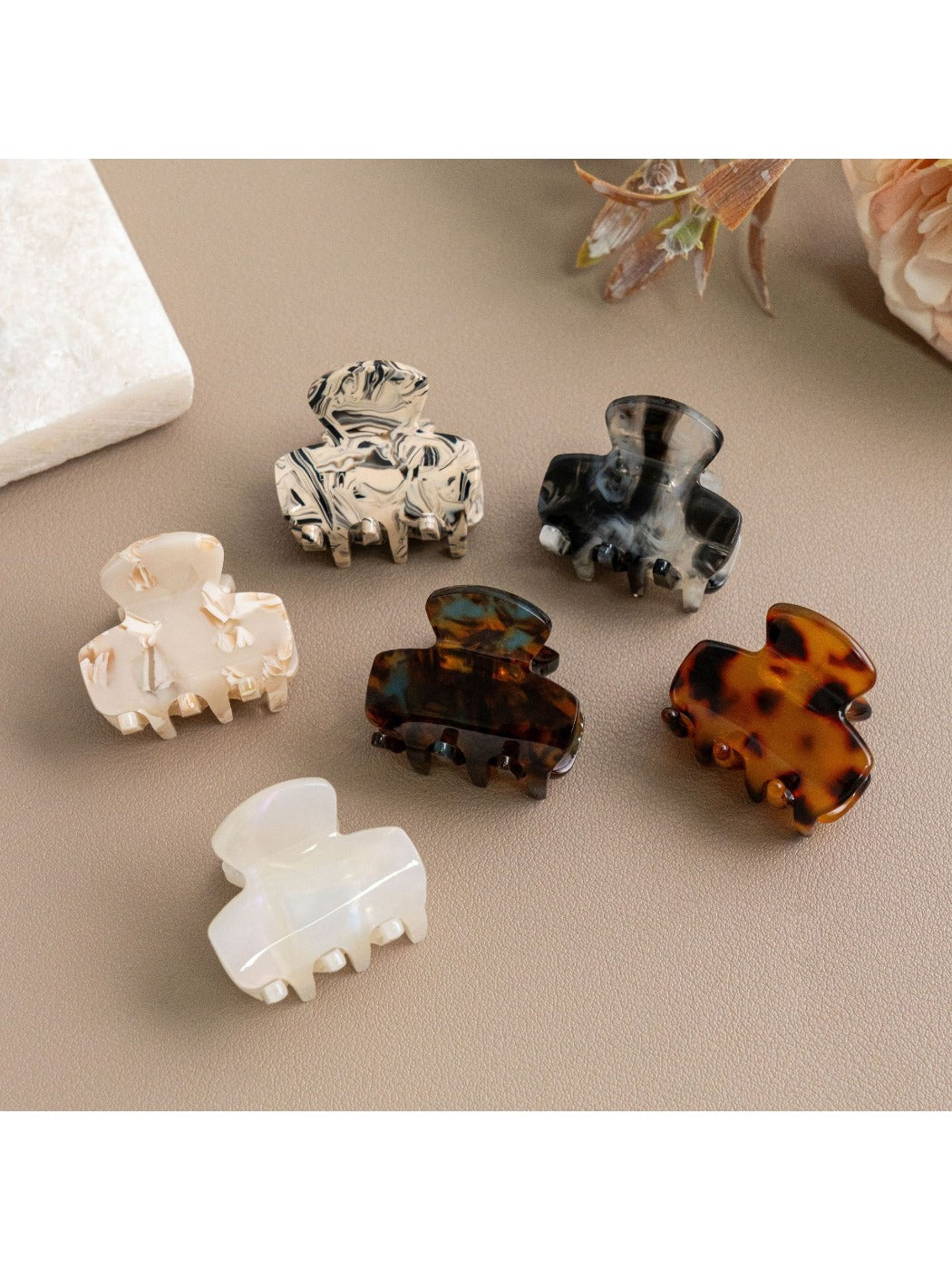 Side view of Beau hair clip displaying curved shape and clasp mechanism