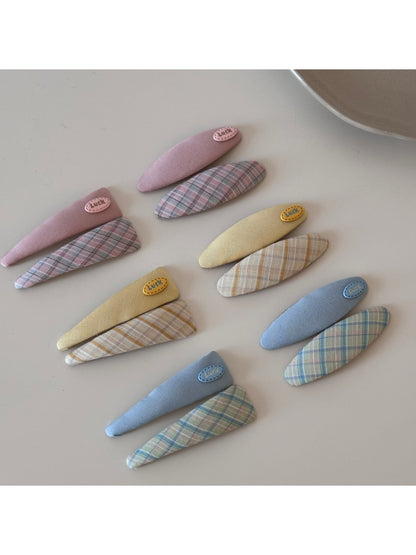 Close-up of Beau oval hair clip showing vibrant color pattern and smooth finish