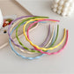 Gifty sweet solid color wavy headband in soft pink fabric on white background