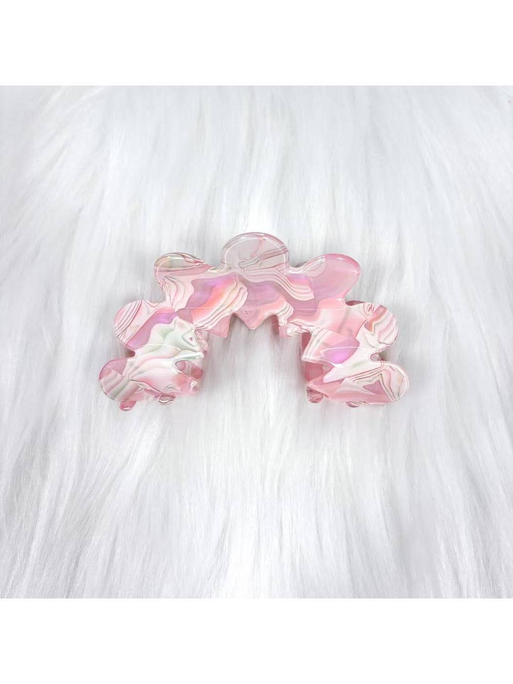 Beau wavy pink hair clip styled in model's hair from back angle