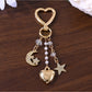 Close-up of silver alloy star charm on keypus keychain