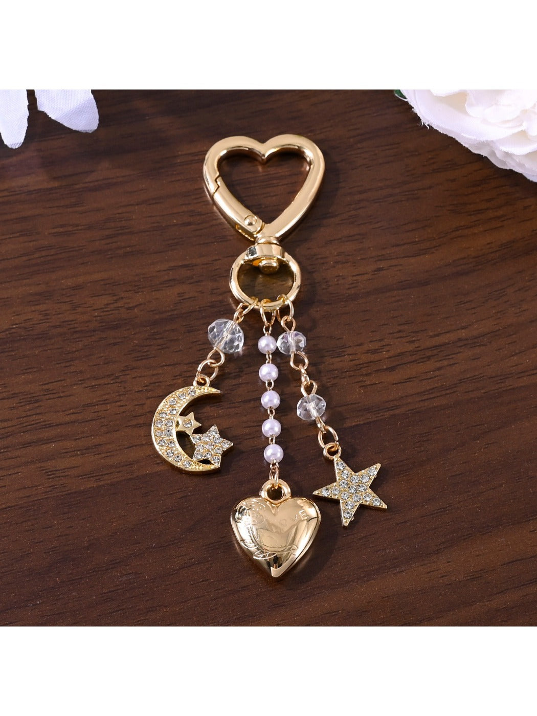 Close-up of silver alloy star charm on keypus keychain