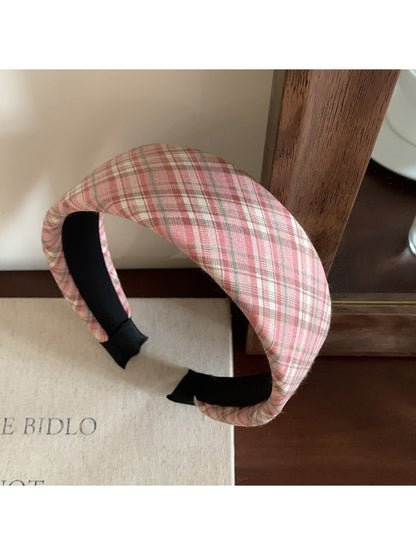 Wide plaid headband folded to show inner lining and stitching details