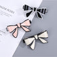 Beau stylish bow hair clip in soft pink fabric on white background