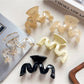 Side view of Beau minimalist hair claw clip highlighting wave design