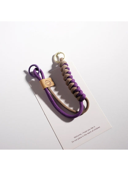 Set of colorful rope keychains arranged in a fan shape