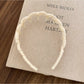 Gifty headband placed next to matching accessories on a wooden surface