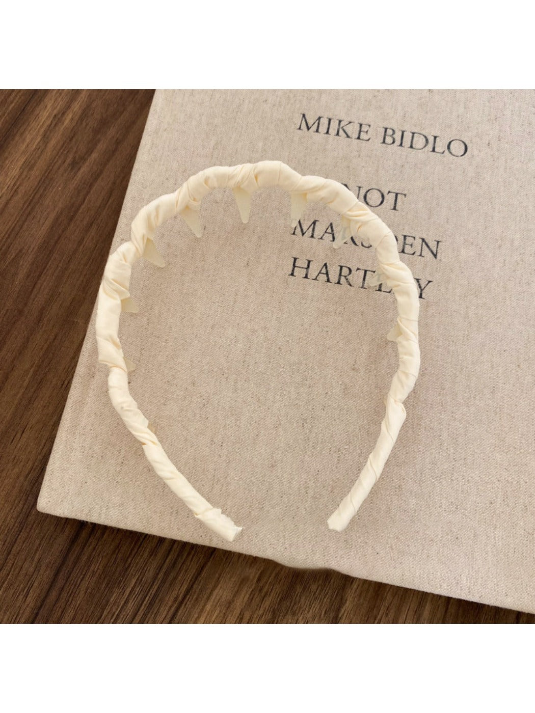 Gifty headband placed next to matching accessories on a wooden surface