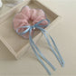 Gifty classic ruffled scrunchie with a large bow in soft pink fabric