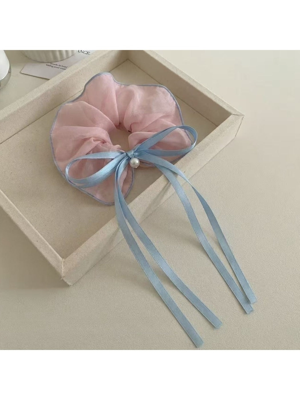 Gifty classic ruffled scrunchie with a large bow in soft pink fabric