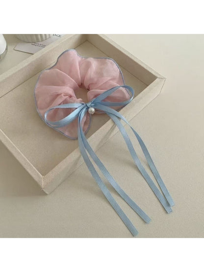 Gifty classic ruffled scrunchie with a large bow in soft pink fabric