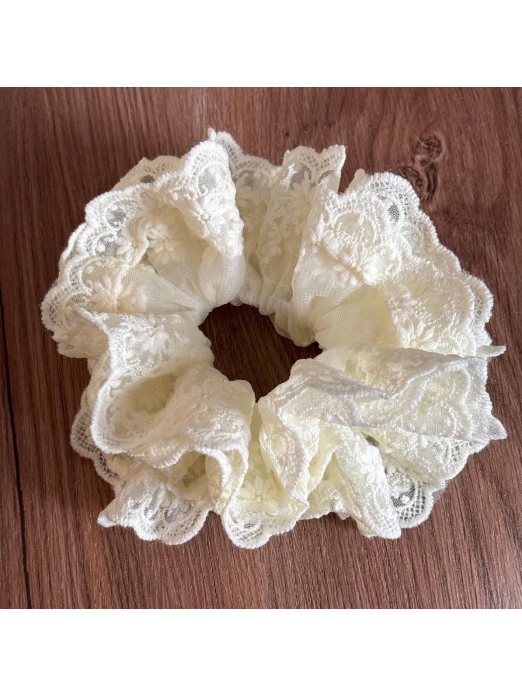 Gifty lace scrunchie paired with matching lace accessories on a table
